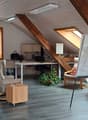Bookshelves, desk, office chair, whiteboard, radiator, windows