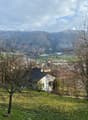 hillside garden with a view of the mountains and the village