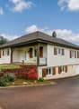 Detached house, 4 windows, brown roof, balcony, garage, paved driveway, garden, parking place, panoramic view