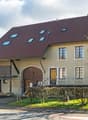 2 story house, brown roof, beige walls, wooden door, windows, balcony, driveway