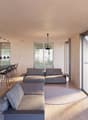 modern design, large windows, gray couches, round rug, kitchen island, bar stools, pendant lights, black sign