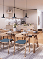 Dining room with wooden table, chairs, and a rug. There is a kitchen in the background with a coffee machine, blender, and a vase with flowers.