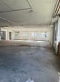 empty room, concrete floor, 6 windows, ceiling lamps