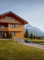 wooden house, on hill, with terrace, mountain view, driveway, parked car