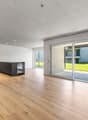 large open space, hardwood floors, sliding glass doors, outdoor terrace, contemporary kitchen