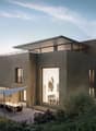 modern style house, gray exterior, large windows, terrace with dining area, lush garden, elevated position
