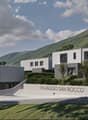 4 modern houses in a row, gray and white, set on the mountainside, large windows, large balconies