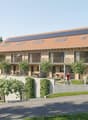 3 story house, wooden exterior, raised ground floor, solar panels on the roof, balcony