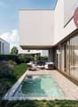 Modern house with a swimming pool in the garden, white exterior, large glass windows, outdoor seating area