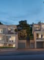 modern design, multi-story, beige walls, large windows, balconies, entrance on first floor, driveways with garages, trees in background