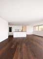 white cabinets, wooden floor, large windows, modern appliances