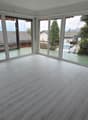 large windows, terrace, white laminate floor, fireplace, outside view