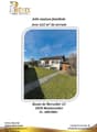 House with a large lawn, driveway, and a small shed.