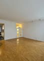 empty room, hardwood floors, fireplace, sliding glass doors to deck