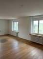 empty room, wooden floor, white walls, three windows, radiators