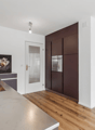kitchen, modern design, wooden floor, stainless steel countertop, integrated oven, wooden cabinets, large sink, faucet