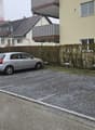 two cars parked, concrete ground, street, hedges
