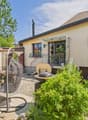 House with a terrace, outdoor dining area, barbecue, and a covered patio.