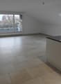 empty room, tiled floor, sliding glass doors, balcony, wooden beam