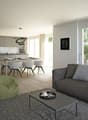 Open living space with dining table, chairs, sofa, coffee table, green beanbag chair, lamp, carpet, bookshelf, open kitchen with oven, stove, sink