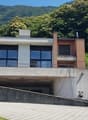modern house, brick and glass, 2 floors, balcony, underground parking