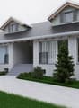 House: gray roof, glass windows, paved driveway, shrubs, front porch