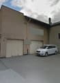 3 story house, beige exterior, double garage, driveway, white car parked