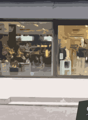 glass shopfront, double door entrance, glass display window, shrubs