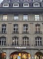 4 story building, multiple windows, balconies, ALDI Suisse store on the ground floor