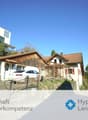 2 story house, brown roof, white walls, garage, car parked in front