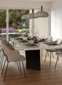 wooden floor, white walls, large glass doors to terrace, modern dining table, chairs, lamps, decor