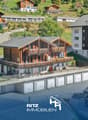 Two story wooden chalet, green roof, solar panels, balconies, several garages, view of the hills, large garden