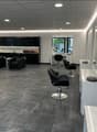 modern and clean salon with black seating and white countertops