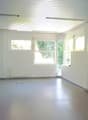empty room, white walls, white ceiling, white floor, windows, radiators