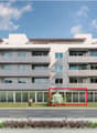 Modern apartment building, 4 floors, balconies, large windows, green lawn, trees, car driving