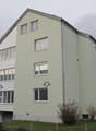 4-story residential building, balcony on the first floor, garage in the ground floor