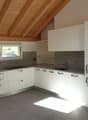 modern kitchen, white cabinets, marble countertop, stainless steel oven, granite floor