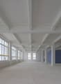 empty room, large windows, beams, exposed ceiling