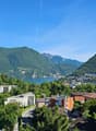 Residential area, mountains, lake, blue sky