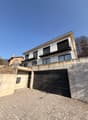 2 story house, garage, balcony with railing
