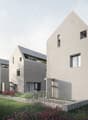 Modern architectural design, raised ground floor, terrace, multiple windows, walkway, bicycles, garden, mountains