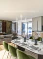 modern design, large windows, marbled wall, sofa, dining table, kitchen island
