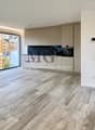 wooden floor, glass doors, sliding windows, kitchen with appliances