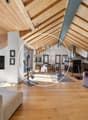 wooden ceiling, wooden floor, sofa, television, view of the mountains