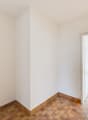 empty room, white walls, wooden floor, white doors, glass door