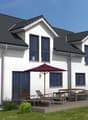 Two story house, modern design, white exterior, gray roof, large windows, outdoor terrace with table, chairs, and umbrella, garden area