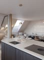 modern kitchen with island, dining area, living room with sofa, glass wall, plants, pendant lights, wooden floor