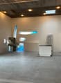 Open floor plan, exposed brick, concrete floor, skylight, large windows, modern kitchen, sink and faucet