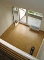 wooden floor, open sliding glass doors, radiator, balcony