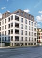 6-story building, white and grey, large windows, balconies